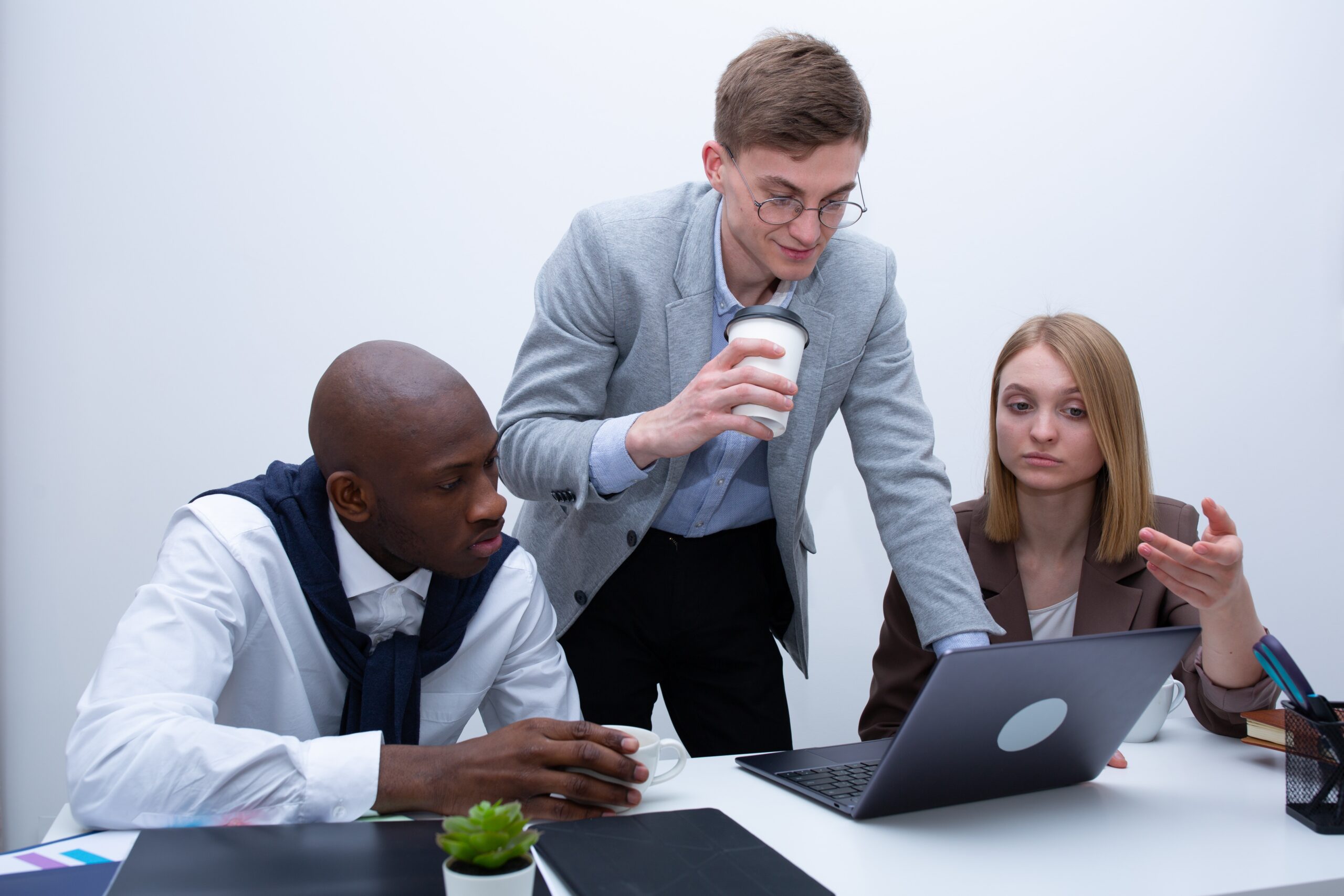Project managers discussing Microsoft Project Online resource management.