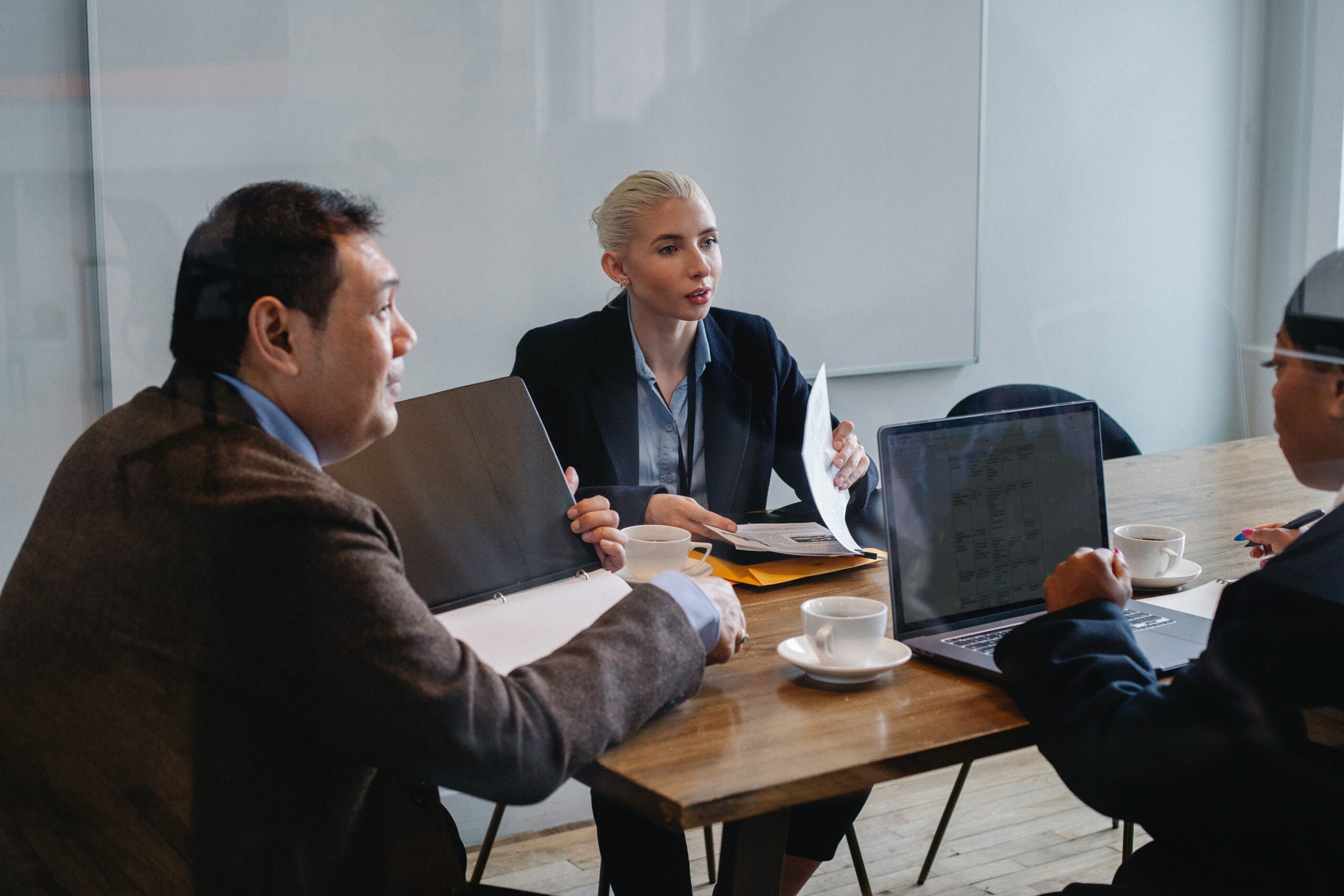 A project manager informing her client how to prevent overallocating resources in Microsoft Project.