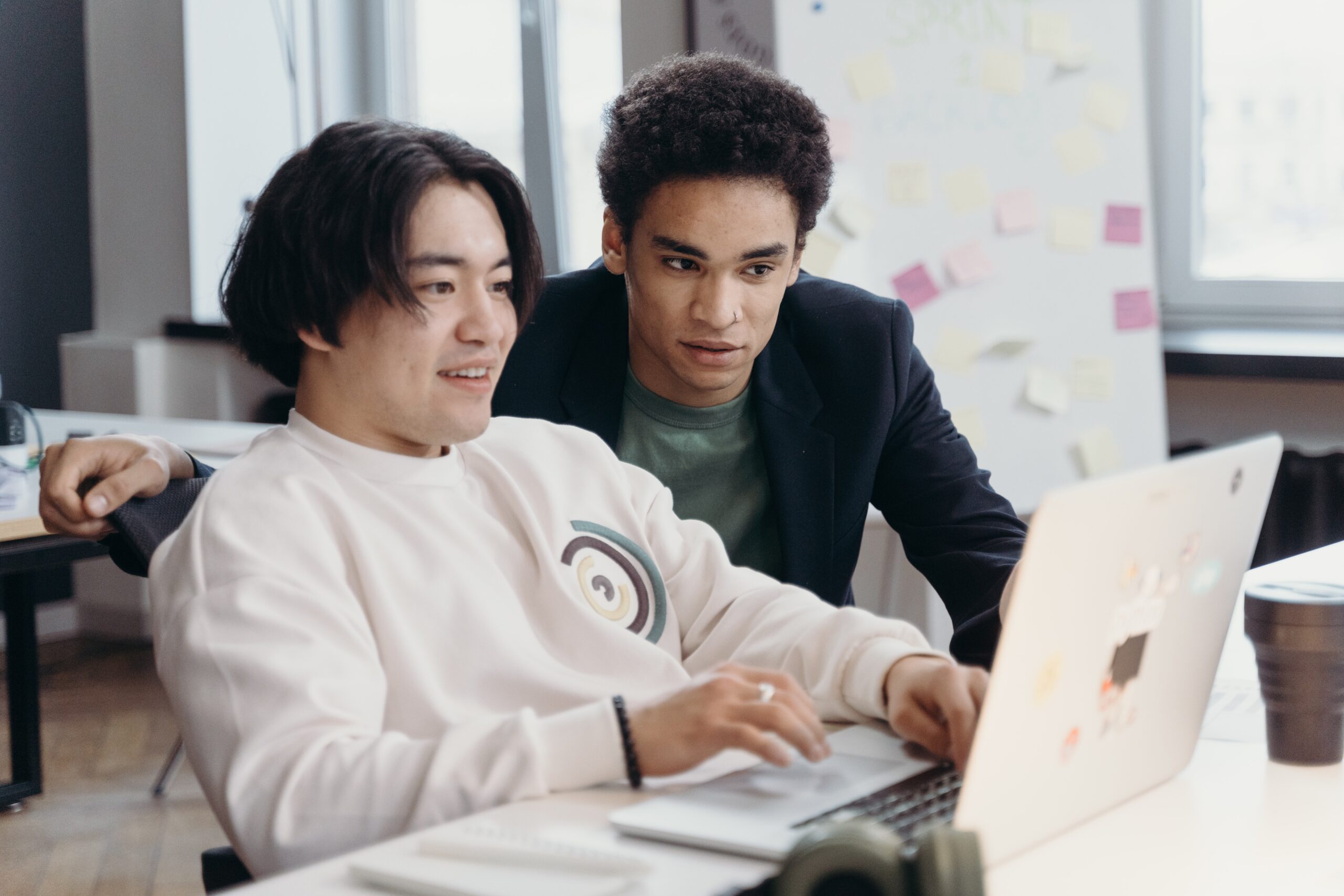 A project manager training a coworker on configuring nested projects in project management tasks for a client.