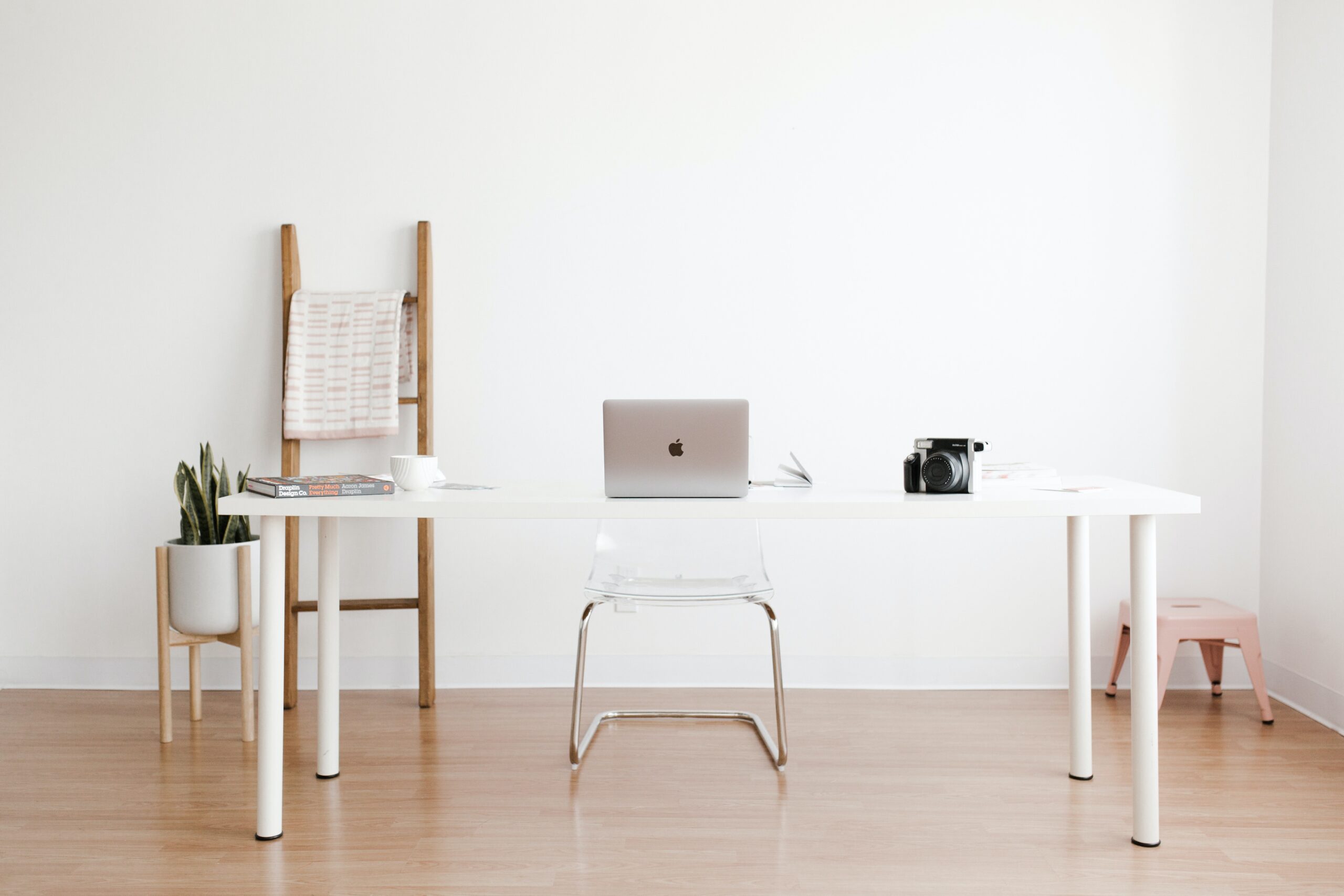 A workspace of a project manager that ponders the difference between Smartsheet vs. Clickup and which one is better for her needs.